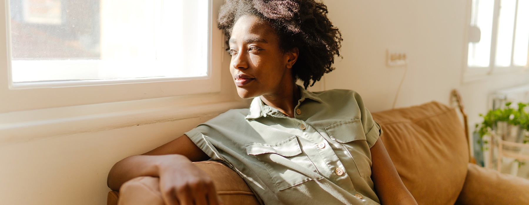 Woman relaxing near a window