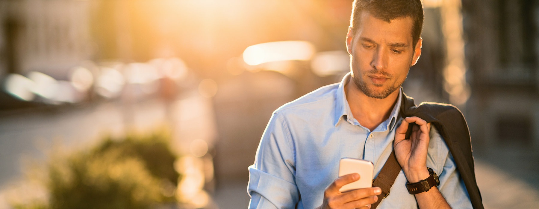 Man sipping coffee outside